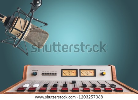 For radio station: background with professional microphone and sound mixer