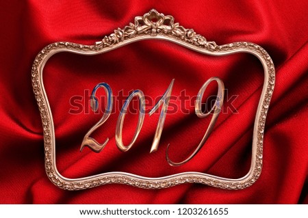 Golden 2019 in a antique frame with red silk background