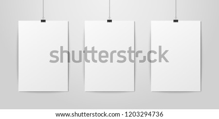 Three Vector Realistic White Blank Vertical A4 Paper Poster Hanging on a Rope with Binder Clip Set on White Wall mock-up. Empty Poster Design Template for Graphics, Mockup
