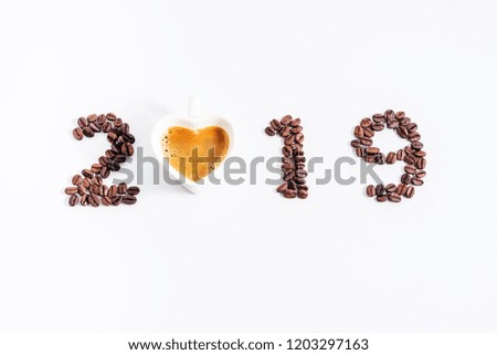 2019 coffee beans and cup of heart shape on white background, New Year concept