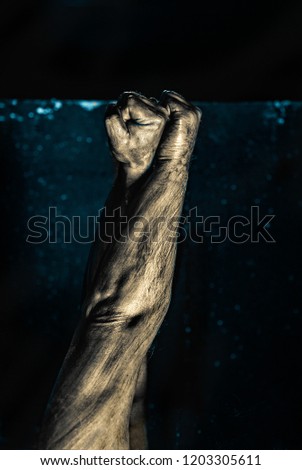 Close-up of a mans arm. Low key shoot.