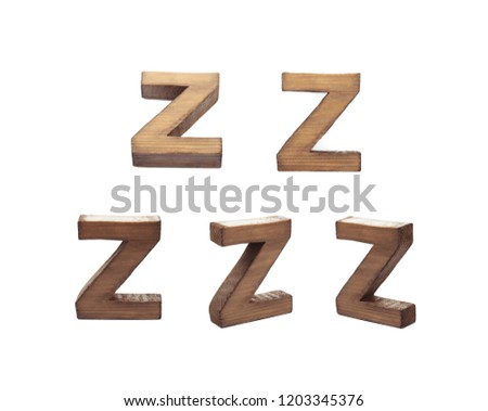 Single sawn wooden Z letter symbol in different angles and foreshortenings isolated over the white background