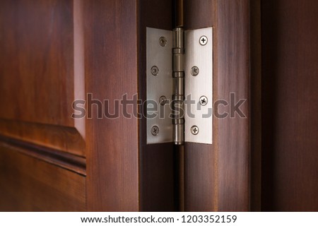 metallic door hinge Royalty-Free Stock Photo #1203352159