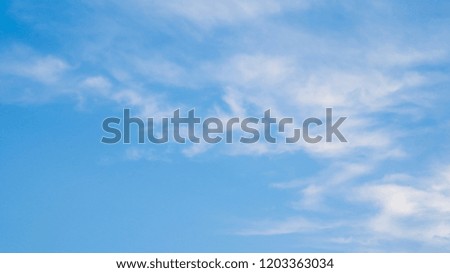wispy clouds and blue sky
