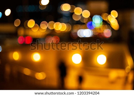 Abstract background. Blurred traffic and city lights bokeh. Urban mood