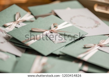Delicate green envelopes with soft pink bows. Wedding invitation cards. Autumn Wedding Invitation. 