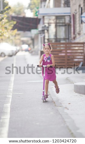 Little girl and scooter