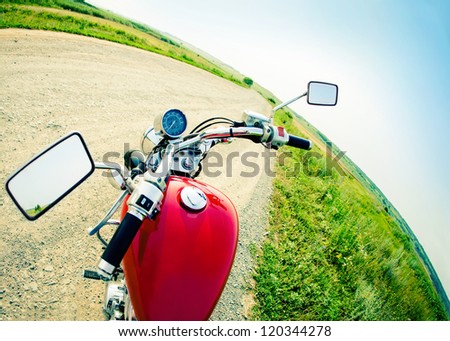 Drivers view of the cockpit in a modern motorcycle on the country road