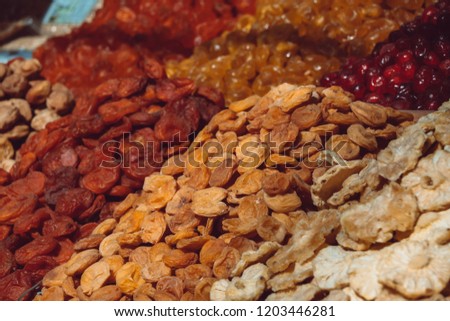 Dry fruits close up on market. Almond, Fennel, Apricot, Arrowroot, Cantaloupe. Background texture.