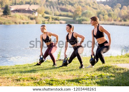 Happy athletic women who exercising on a training