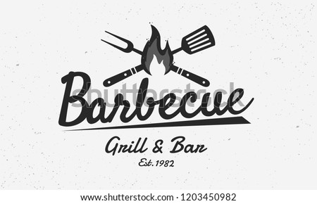 Barbecue restaurant - vintage logo concept. Logo of Barbecue, Grill and Bar with fire, grill fork and spatula. BBQ logo template. Grunge texture. Vector illustration Royalty-Free Stock Photo #1203450982