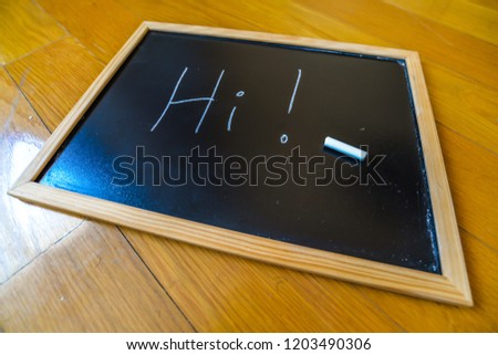 Hi written on a chalk board
