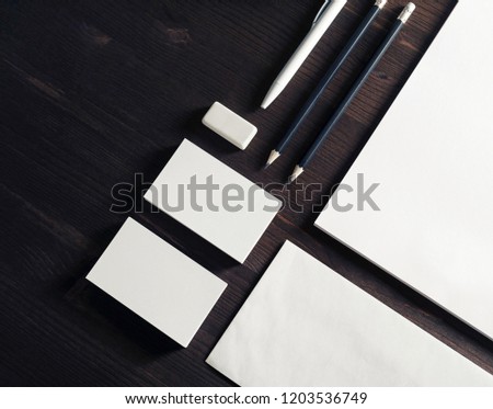 Blank branding identity set on wooden background. Top view. Flat lay.