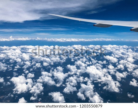The wing of aeroplane on the clouds