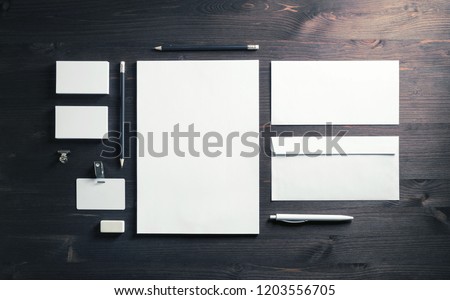 Blank corporate identity template on wooden background. Photo of blank stationery set. Mockup for design presentations and portfolios. Top view. Flat lay.