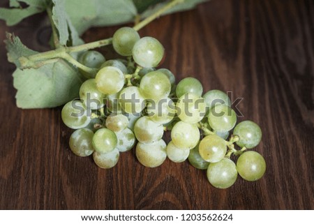 White grapes on wooden table