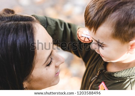 mother and son in autumn park