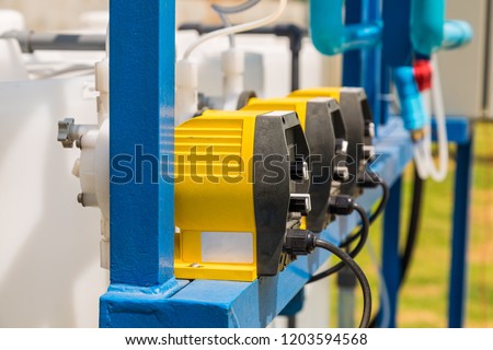 Chemical feed pumps for water treatment system Royalty-Free Stock Photo #1203594568