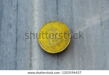 Crypto currency Gold Bitcoin, BTC, macro shot of Bitcoin coins on rock background,  bitcoin mining concept