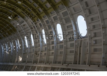empty airplane airframe / fuselage without any equipment and no panels installed Royalty-Free Stock Photo #1203597241