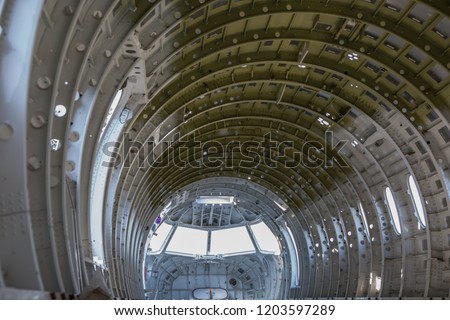 empty airplane airframe / fuselage without any equipment and no panels installed Royalty-Free Stock Photo #1203597289