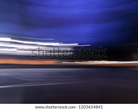 Abstract background of bright white lines with a motion concept and stunning blue dusk times