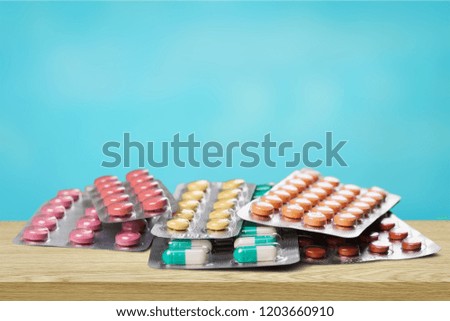 Heart sign make of pills on  background