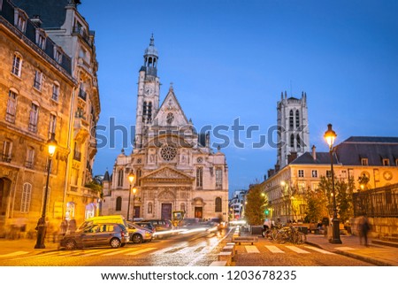 Illuminated streets of Paris during the blue hour in the evening, with Saint-Etienne-du-Mont church, Paris, France