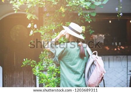 Young asian woman traveler with hat and bag travelling in Changmai, Thailand.