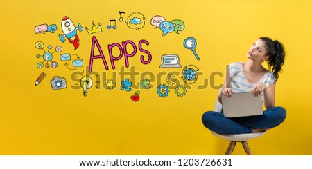 Apps with young woman using a laptop computer 