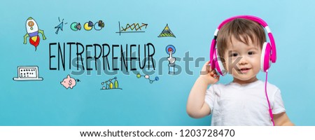 Entrepreneur with toddler boy with headphones on a blue background