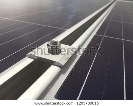 Camp anchor between two panels solar cells on the roof