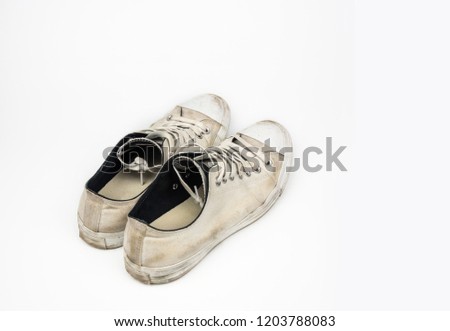 Dirty sneaker shoes isolated on white background