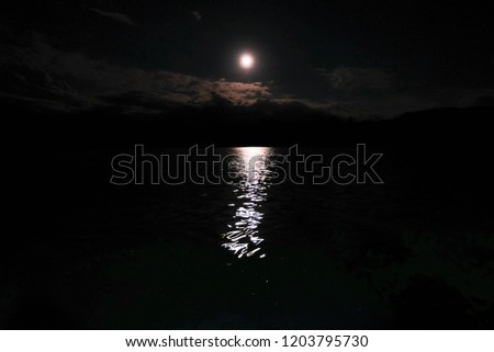 At night the moon reflects the light from the surface below.