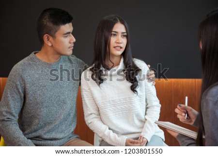 Young family  at a reception of psychologist