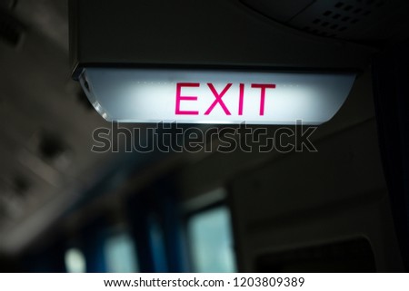 Exit door sign,Emergency exit sign symbol with red arrow on the bus for safety transportation