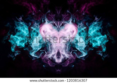 Mocap for cool t-shirts. Dense multicolored smoke of   blue, purple and pink colors in the form of a skull, monster, dragon  on a black isolated background. 