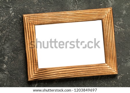 blank photo frame on black concrete background, with free text space