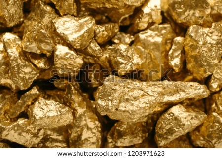 Many gold nuggets as background