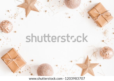Christmas composition. Christmas gifts, golden decorations on white background. Flat lay, top view, copy space