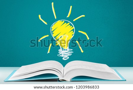 Idea Fluorescent light bulb and Open Book isolated on  background