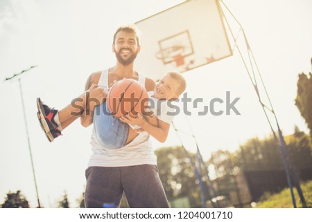 I love day with dad. Father and son on basket court.