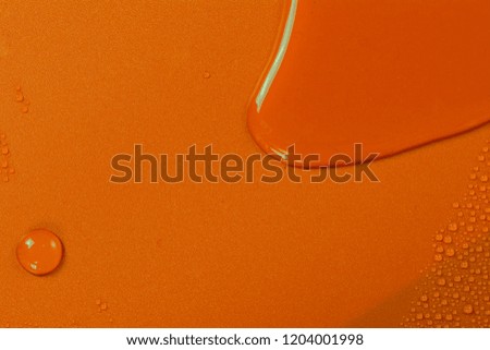 Close up of water drops on orange tone background. Abstarct yellow wet texture with bubbles on window glass surface. Raindrop, Realistic pure water droplets condensed for creative banner design. Brown