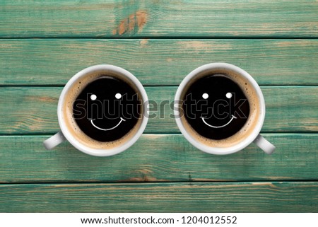 Two coffee cup on desk