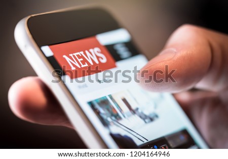 Online news in mobile phone. Close up of smartphone screen. Man reading articles in application. Hand holding smart device. Mockup website. Newspaper and portal on internet. Royalty-Free Stock Photo #1204164946