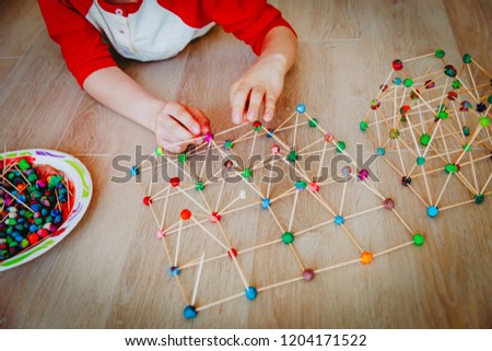 child making geometric shapes, engineering and STEM education