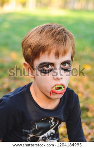 Little funny halloween vampire boy