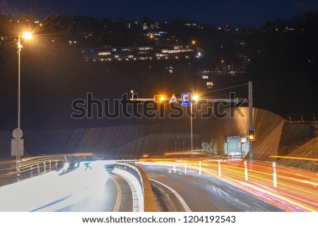 The car light trails in front of a tunnel at Lugano on Switzerland