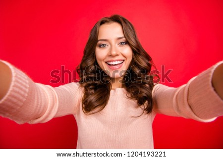 Time take selfie! Close up portrait of sweet, gorgeous, nice, stunning, adorable, good-looking person with toothy smile hold in hand modern smartphone and make photo isolated on shine red background