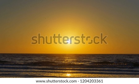 Sunset on the beach with the sea